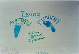 Little footprints and a thumbprint on the wall